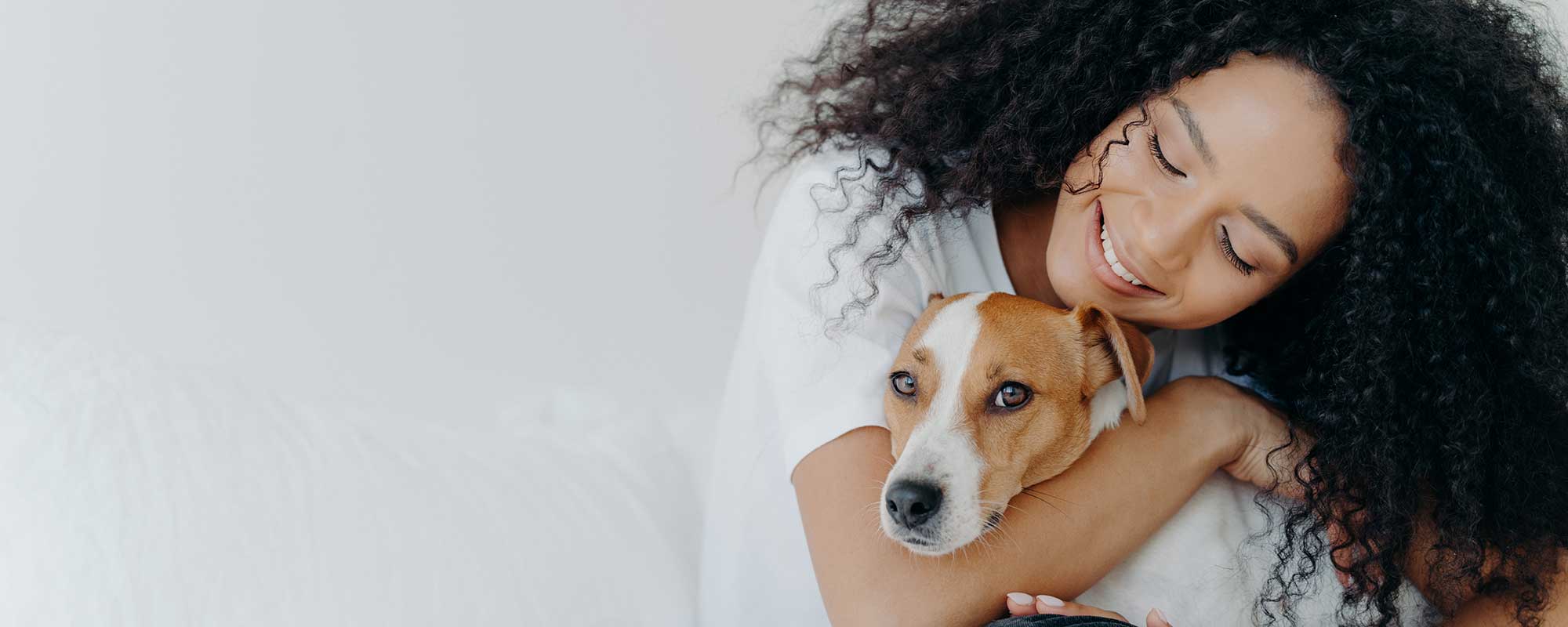 A woman holding a dog